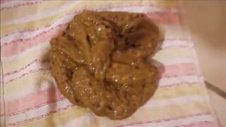 Blonde girl is shitting a big quantity