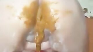 Gorgeous girl pooping and leaking shit on herself