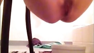 Girl is shitting in the plastic bowl