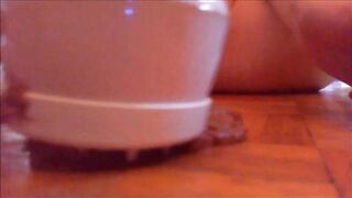 Woman masturbating with vibrator and shit