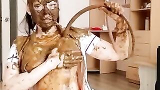 Gorgeous babe smearing shit and sucking dildo