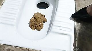 Slutty lady shitting in the toilet