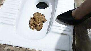 Slutty lady shitting in the toilet