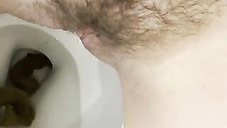 Blonde babe takes a huge shit on the toilet