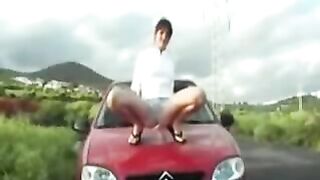 Babe pissing on the car