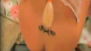 Tattooed babe dropping shit