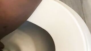 Ebony lady pushing pebbles