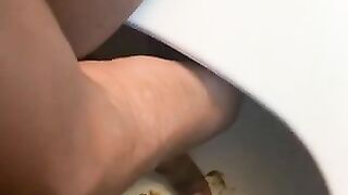 Ebony lady pushing pebbles