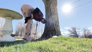 Girl pisses in her yard