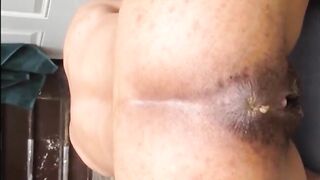 Hairy lady shitting doggystyle closeup