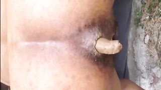 Hairy lady shitting doggystyle closeup