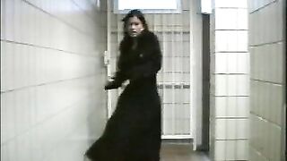 Brunette squirts out enema against bathroom stall