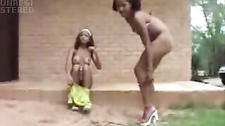 Cute African chicks pissing together