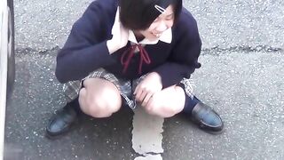 Japanese teen girl with shaved pussy pissing in the park