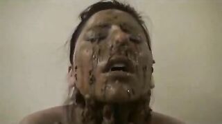 Pretty girl rubs warm shit on her lovely face