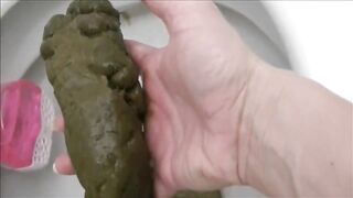 Woman shitting a very large turd