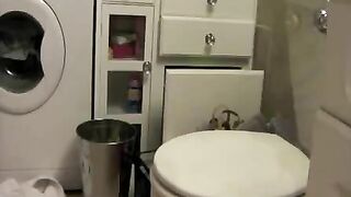 Sweet blonde lady shitting on the toilet seat