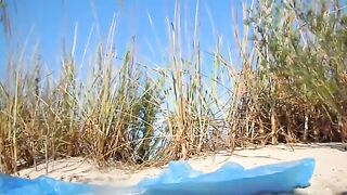 Brunette babe pooping at beach