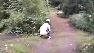 Lovely amateur blonde girl shtting in the forest