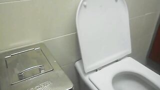 Elena takes a shit in a public toilet