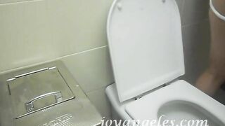 Elena takes a shit in a public toilet