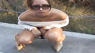 Stylish milf in high boots shits outdoor