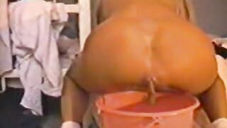 Blonde Peeing And Shitting Into A Bucket
