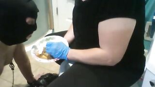 Mistress feeds messy shit to slave