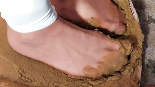 Dirty brown pantyhose glue of dog scat