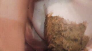 Asshole clenching while shit hangs out