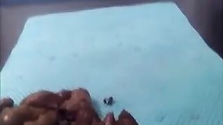 Woman squats over a pile of fresh shit on a mat