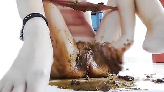 Girl takes a dump on her pink panties while squatting