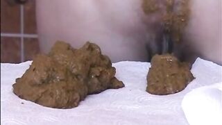 Babe shitting a big load of diarrhea on the table - EroProfi