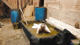 Chubby hot babe masturbates in the cowshit