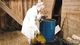 Nasty blonde girl masturbates in the cowshit