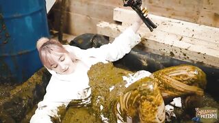 Nasty blonde girl masturbates in the cowshit