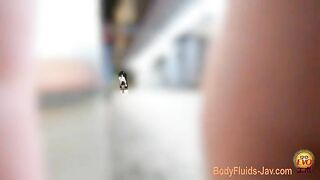 Japanese girl in high boots dropping heavy load