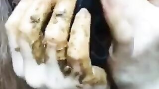 Huge tits lady smearing shit closeup