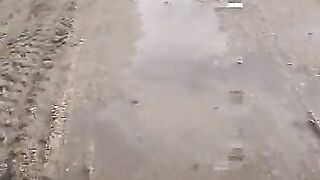 Amateur round ass girl shitting in the sand