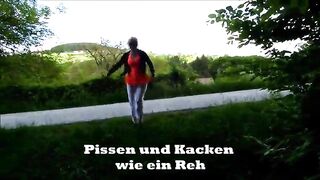 Mature lady poops in the forest next to the road