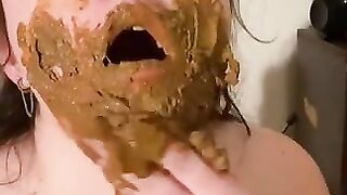 Girl smearing shit on her lovely face