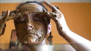 Lady smearing shit on her lovely face