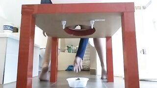 Woman takes a massive shit in a bowl under a table