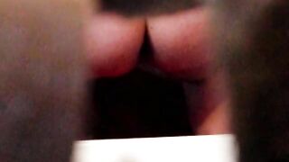 Woman squats and pisses into a toilet