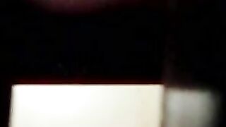 Woman squats and pisses into a toilet