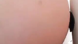 Woman plays with her fresh shit in shower