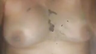 Woman spreads shit on her tits and stomach