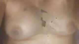 Woman spreads shit on her tits and stomach