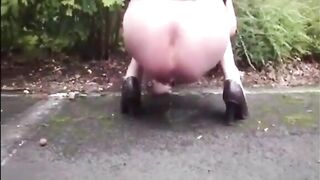 Blonde mature shitting an hard turd in a public parking