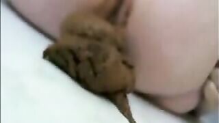 Fat chick shits on a white towel